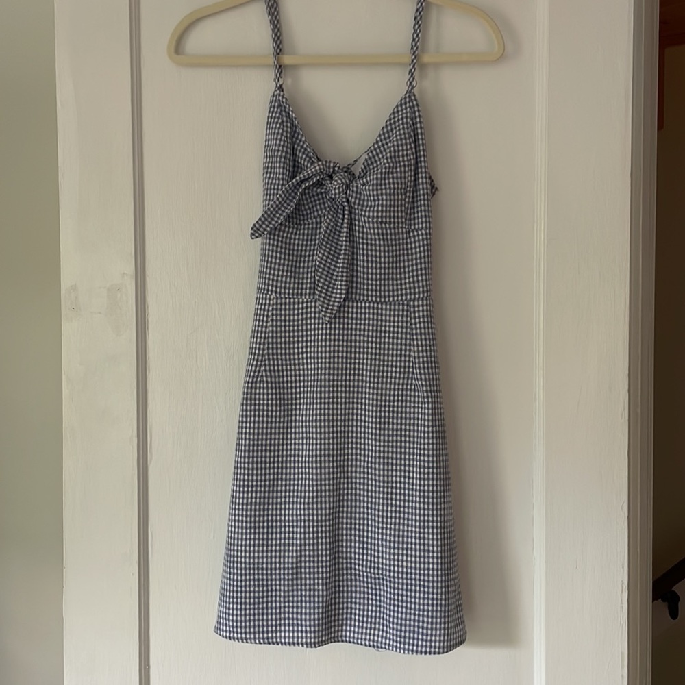 Just one answer gingham mini dress with zipper/tie back. Size small.